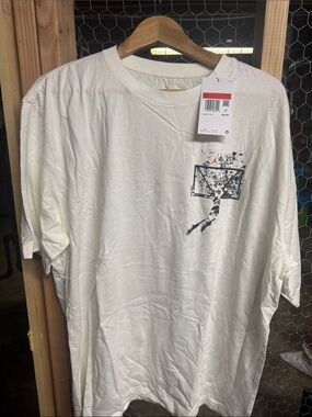 Jordan White Short Sleeve Tee with Black Basketball Graphic